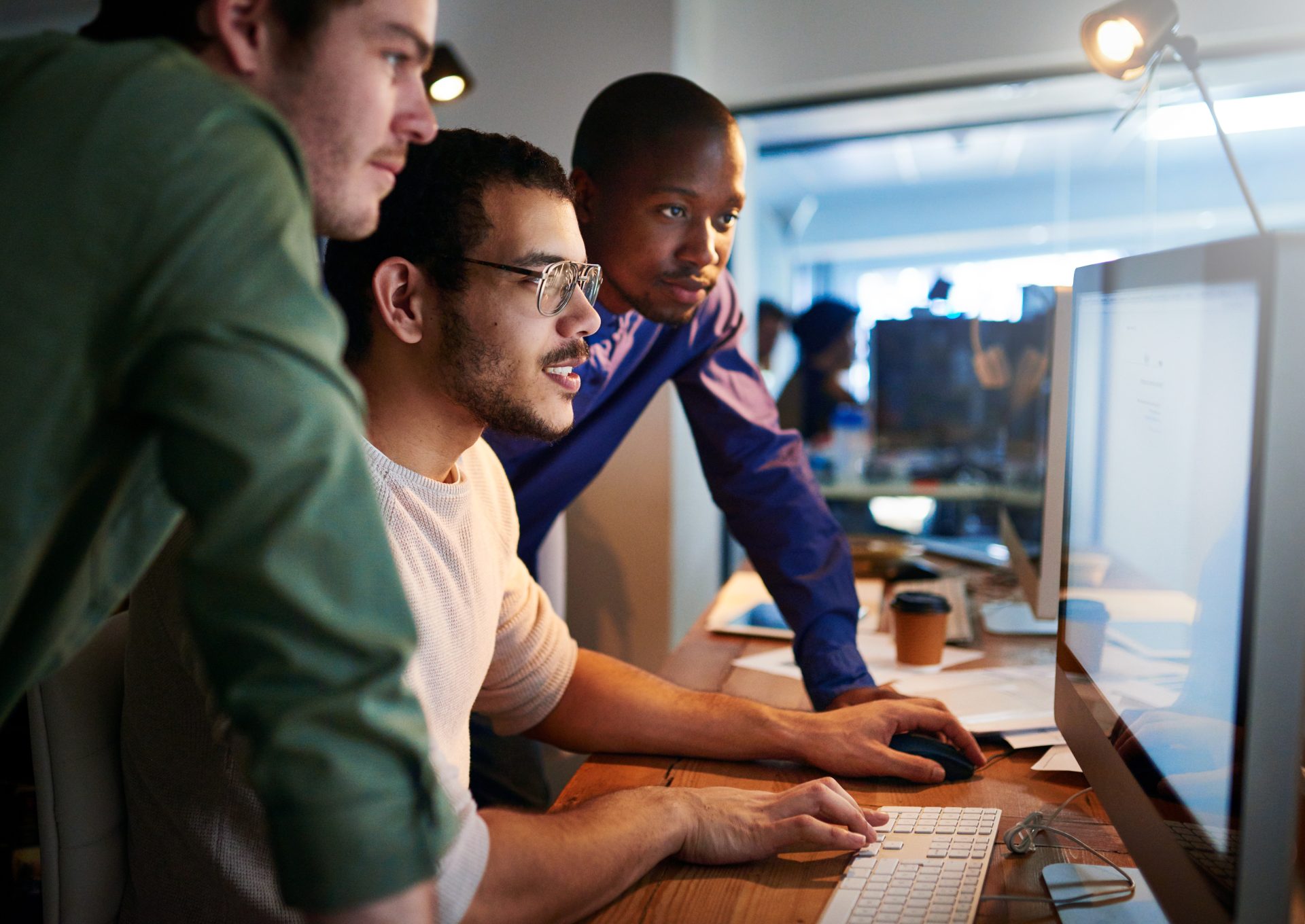 Shot of a team of young businesspeople working late in the office